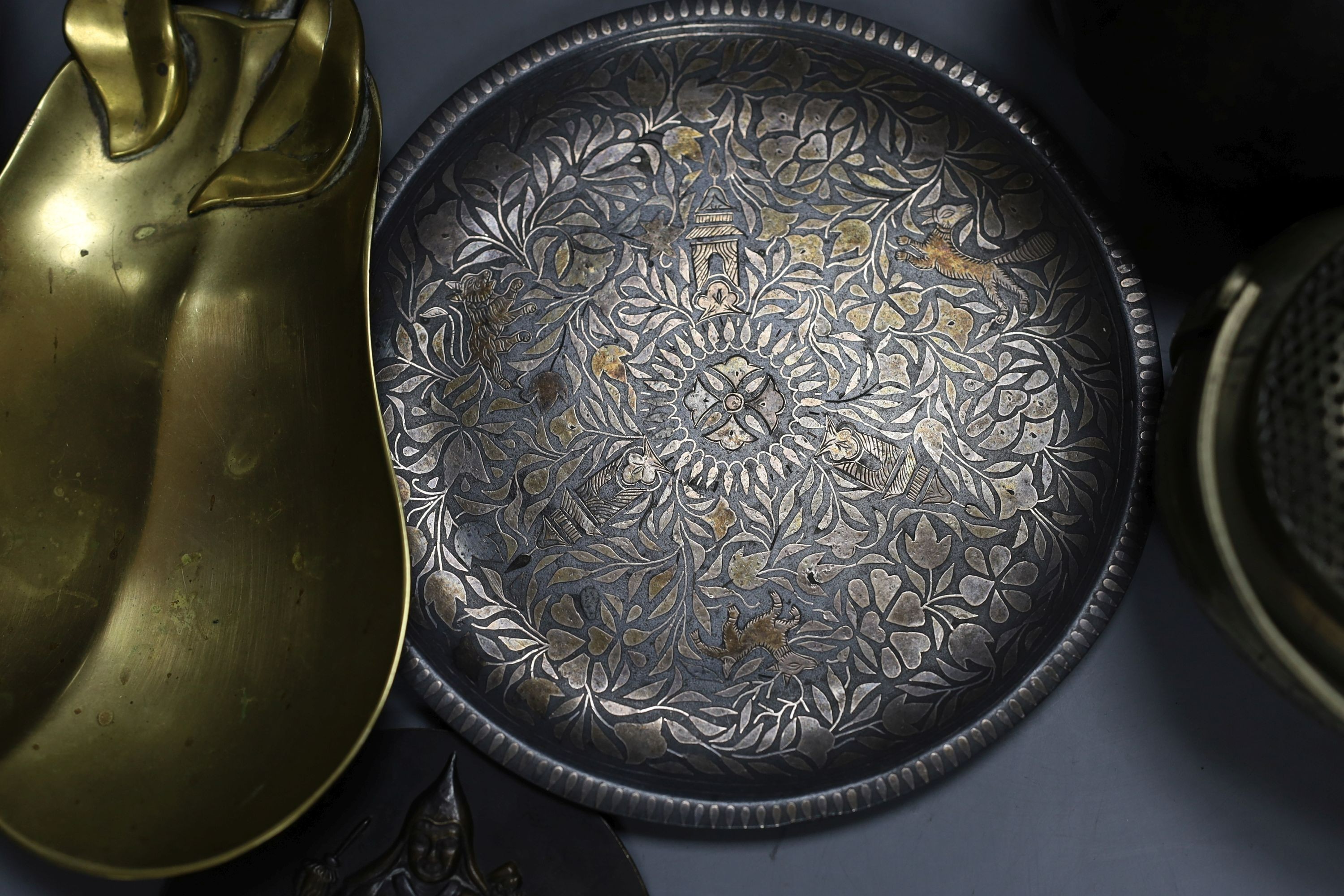 Metalware to include - a Sino-Tibetan bronze amulet, a Bidri ware dish, a Chinese paktong handwarmer Asian wood balls with inset coins etc